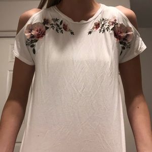 Embroidered white open shoulder top.